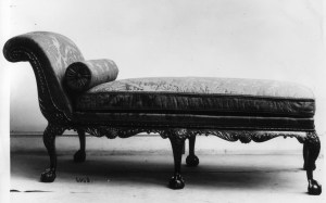 Black and white historical photograph of a 19th century chaise lounge for Flash Fiction: Grounded by Malin James